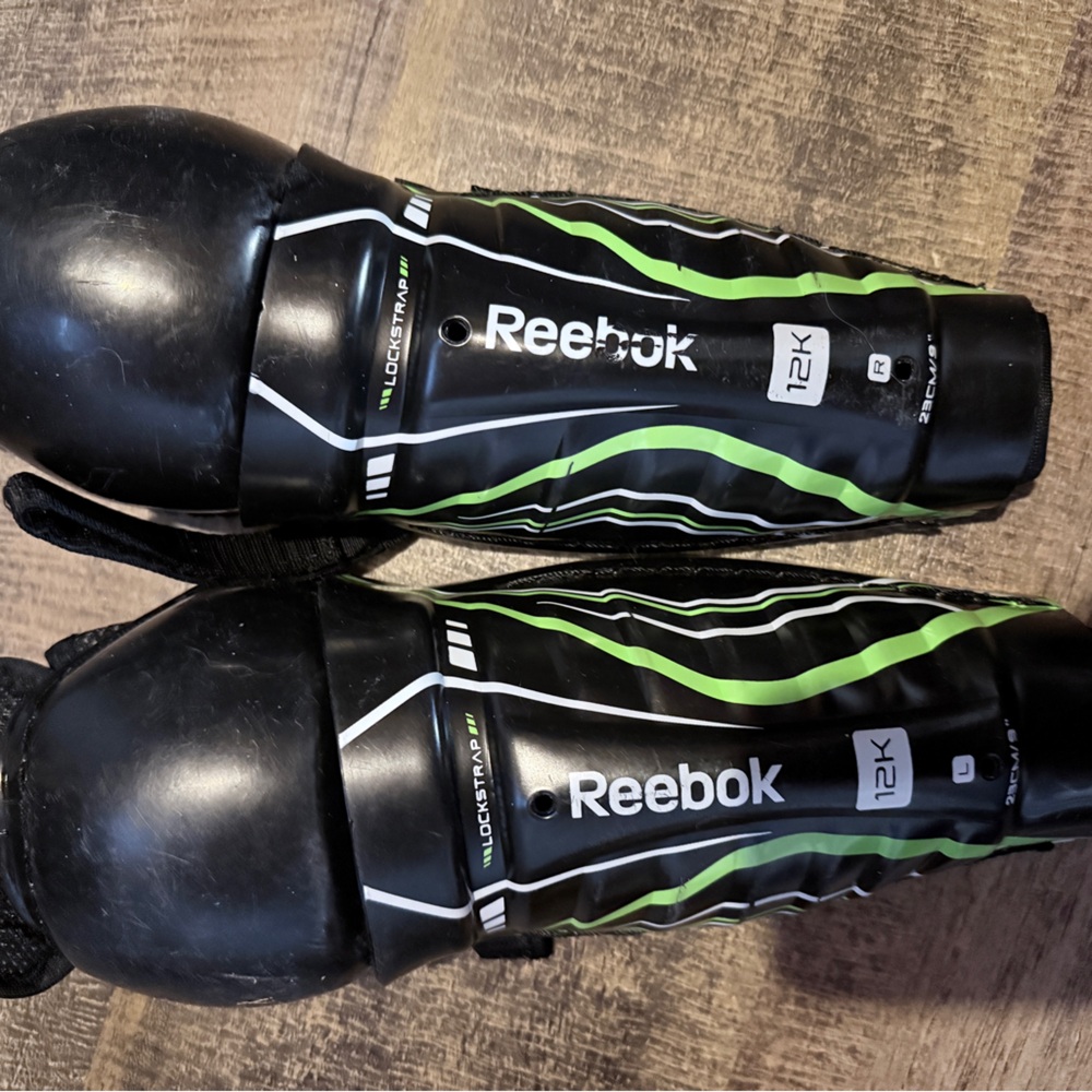 Reebok Black and Green Hockey Knee Protective Gear
